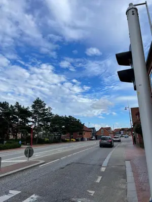 a car driving down a street with a traffic light at Apartment Vanilla - 2 rooms and one bathroom in Struer