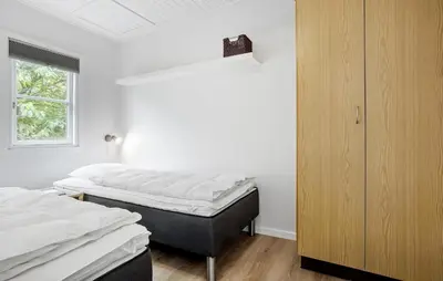 two twin beds in a room with a window at Stunning Home In Vestervig With Kitchen in Vestervig