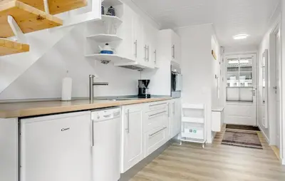 a kitchen with white cabinets and a sink at Stunning Home In Vestervig With Kitchen in Vestervig