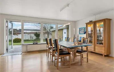 a dining room with a table and chairs at 3 Bedroom Lovely Home In Vestervig in Vestervig