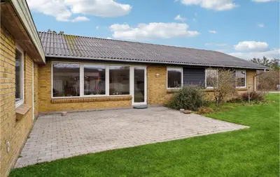 a brick house with a patio in the yard at 3 Bedroom Lovely Home In Vestervig in Vestervig