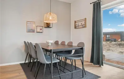a dining room with a table and chairs at Awesome Home In Thisted With Sauna in Thisted