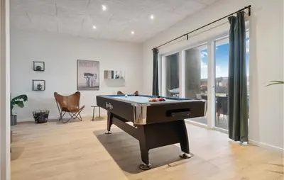 a living room with a pool table in it at Awesome Home In Thisted With Sauna in Thisted
