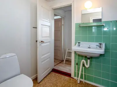 a bathroom with a sink and a toilet at 8 person holiday home in Lemvig-By Traum in Lemvig