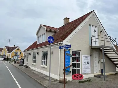 a building on the side of a street at Stor lejlighed ved stranden i Agger Cold Hawaii in Agger