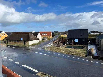 a view of a town with houses and a street at Stor lejlighed ved stranden i Agger Cold Hawaii in Agger