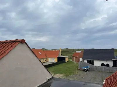 a view of a group of houses with roofs at Stor lejlighed ved stranden i Agger Cold Hawaii in Agger