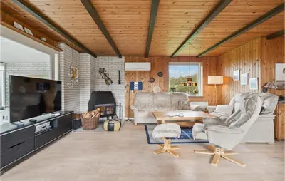 a living room with two chairs and a couch and a table at 3 Bedroom Beautiful Home In Spøttrup in Spottrup
