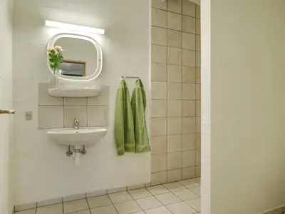a bathroom with a sink and a mirror at 5 star holiday home in Spøttrup-By Traum in Spottrup
