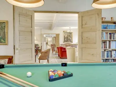 a living room with a pool table and bookshelves at 5 star holiday home in Spøttrup-By Traum in Spottrup