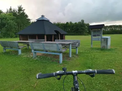 a group of benches and a gazebo in a park at Comfortable 3- bedroom villa with free parking in Roslev
