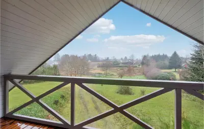 a window view of a field from a house at 3 Bedroom Amazing Home In Højslev in Højslev