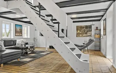 a white staircase in a living room with furniture at Stunning Home In Hurup Thy With Wifi in Boddum