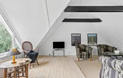 a living room with a couch and chairs and a tv at Stunning Home In Hurup Thy With Wifi in Boddum