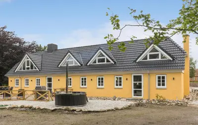 a yellow house with a black roof at Stunning Home In Hurup Thy With Wifi in Boddum