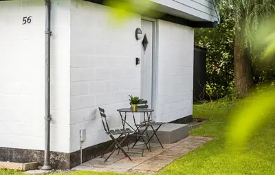 a table and chairs on the side of a house at Amazing Home In Farsø With Wifi in Farsø