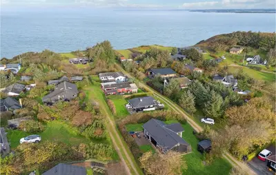 an aerial view of a house with the ocean at Cozy Home In Struer With Wifi in Struer