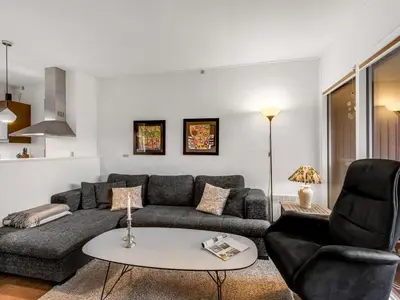 a living room with a couch and a table at Apartment Alvy - 100m to the fjord by Interhome in Lemvig