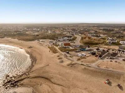 an aerial view of a beach with houses and the ocean at Holiday Home Unge - 75m from the sea by Interhome in Torsted