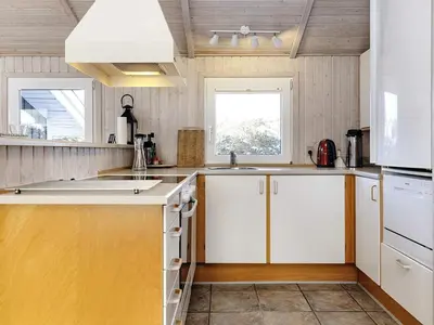 a kitchen with white cabinets and a sink at 7 person holiday home in Fjerritslev-By Traum in Fjerritslev