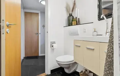 a bathroom with a toilet and a sink at Beautiful Home In Hurup Thy With Wifi in Doverodde