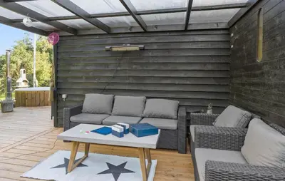 a patio with a couch and a table with stars on it at 3 Bedroom Amazing Home In Fur in Fur