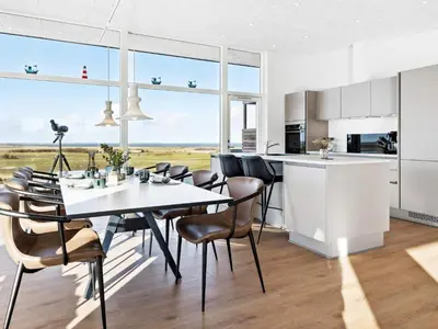 a kitchen and dining room with a table and chairs at 5 star holiday home in Lemvig-By Traum in Lemvig