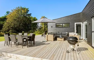 a barbecue on a wooden deck with a grill at Amazing Home In Spøttrup With Wifi in Spottrup
