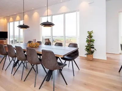 a dining room with a table and chairs at 5 star holiday home in Lemvig-By Traum in Lemvig