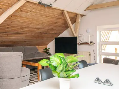 a living room with a table and a tv at 20 person holiday home in Karby-By Traum in Karby