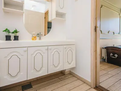 a bathroom with a sink and a mirror at 20 person holiday home in Karby-By Traum in Karby