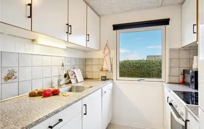 a kitchen with a sink and a window at 4 Bedroom Cozy Home In Vinderup in Vinderup