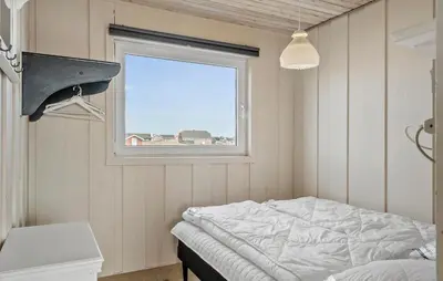 a bedroom with a bed and a window at Awesome Home In Harboøre With Wifi in Harboør