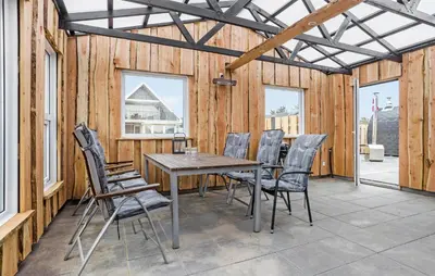 a dining room with a table and chairs at Lovely Home In Vestervig With Wifi in Vestervig