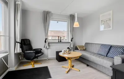 a living room with a couch and a table at Lovely Home In Vestervig With Wifi in Vestervig