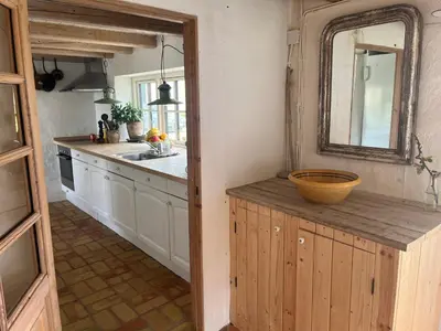 a kitchen with a counter with a bowl on it at The Fishermen's House - charming and close to beach in Vang