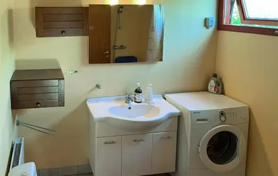 a bathroom with a sink and a washing machine at 3 Bedroom Gorgeous Home In Vinderup in Vinderup