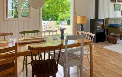 a dining room with a table and chairs at 3 Bedroom Gorgeous Home In Vinderup in Vinderup