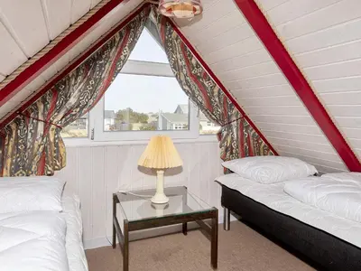 a room with two beds and a table with a lamp at 6 person holiday home in Thisted-By Traum in Thisted