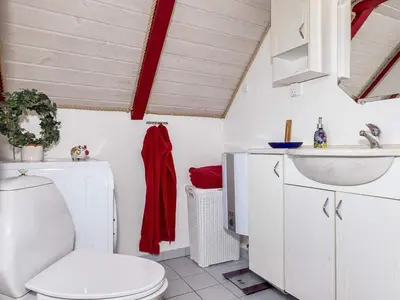 a bathroom with a toilet and a sink at 6 person holiday home in Thisted-By Traum in Thisted