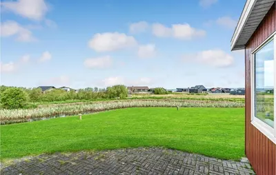 a large backyard with a large grassy yard at Holiday Home Vinderup 5 in Vinderup