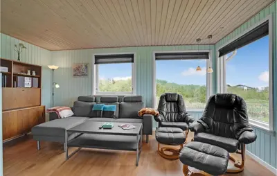 a living room with a couch and two chairs at Holiday Home Vinderup 5 in Vinderup