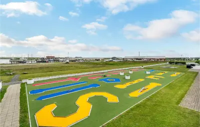 an aerial view of a playground with colorful animals on the grass at Pet Friendly Apartment In Vestervig in Vestervig