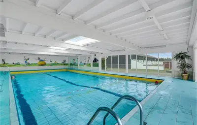 a large indoor swimming pool with a large pool at Pet Friendly Apartment In Vestervig in Vestervig