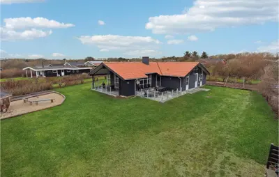 an aerial view of a house with a yard at Cozy Home In Vestervig With Sauna in Vestervig