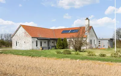 an old white house with an orange roof at 5 Bedroom Gorgeous Home In Thyholm in Thyholm