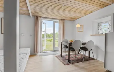 a dining room with a table and chairs at Cozy Apartment In Ranum With Wifi in Ranum
