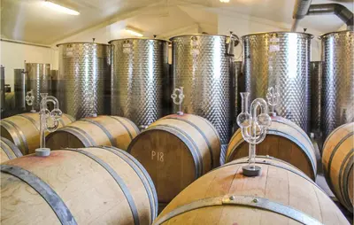 a bunch of wine barrels in a cellar at Cozy Apartment In Ranum With Wifi in Ranum