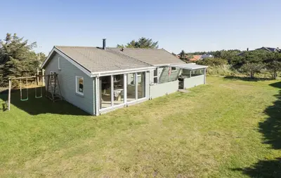 a small house with a playground in a yard at Lovely Home In Thisted With Kitchen in Thisted