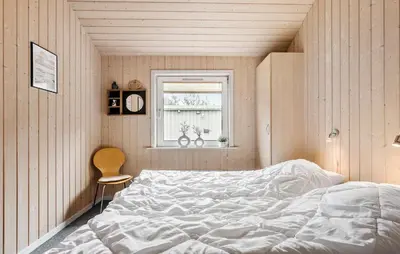 a bedroom with a large white bed and a window at Lovely Home In Thisted With Kitchen in Thisted